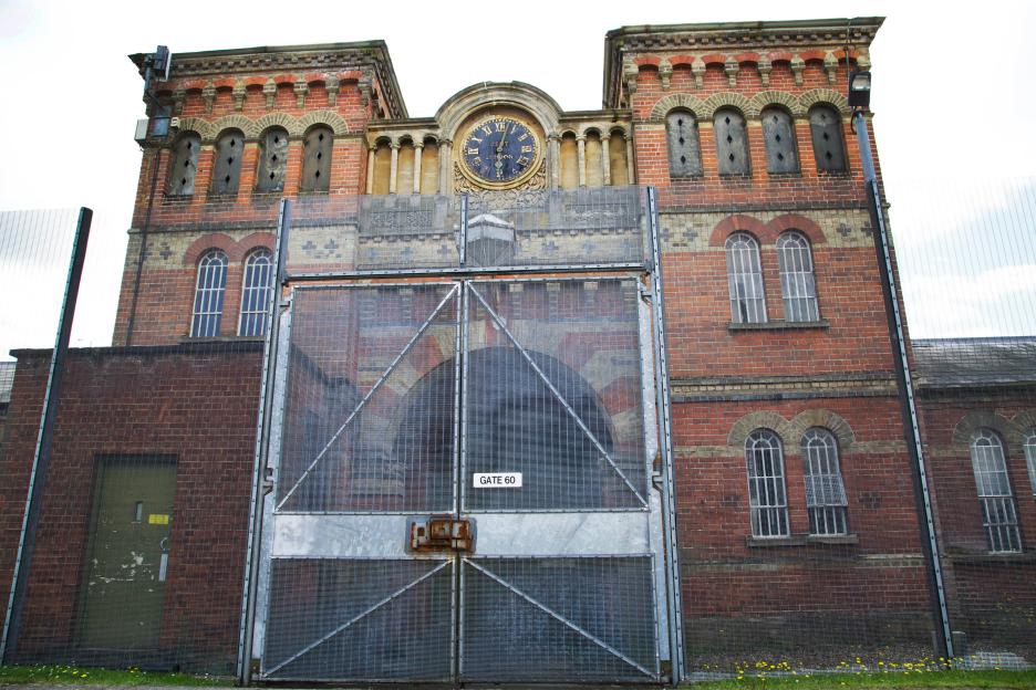 Broadmoor Hospital entrance gate with a clock tower above.