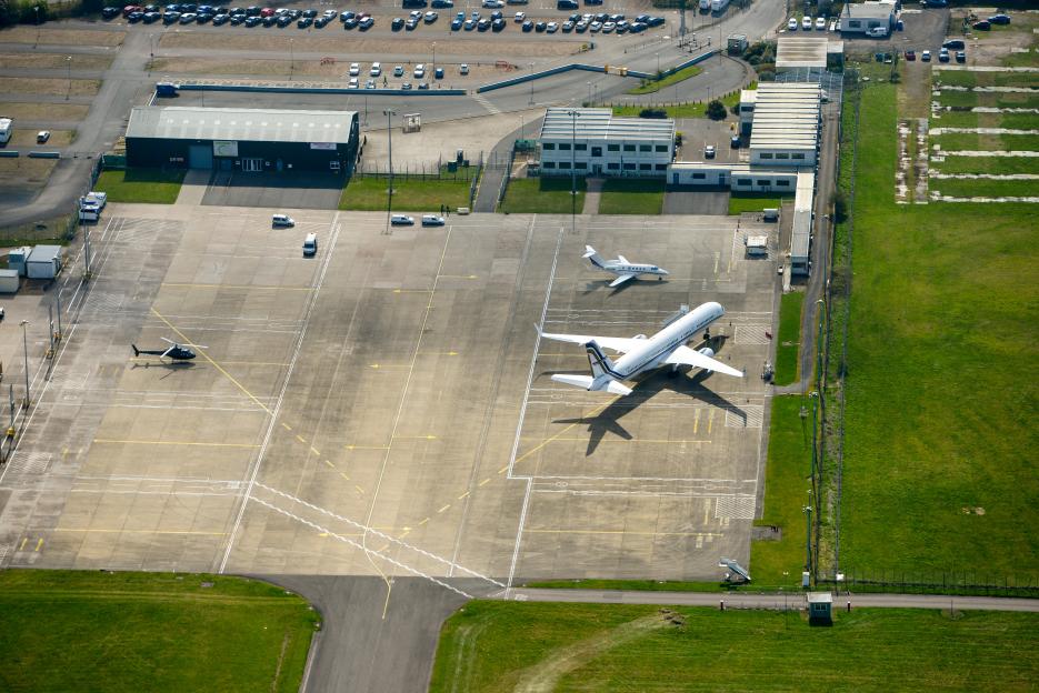 Aerial view of aircraft parked on the apron of Coventry Airport.