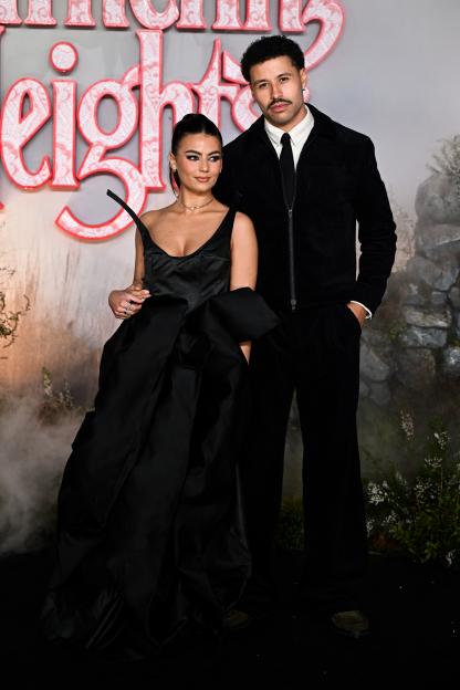 Megan Forte Clarke in a black gown and Connor Phillips in a black suit attend the UK Premiere of "Wuthering Heights".