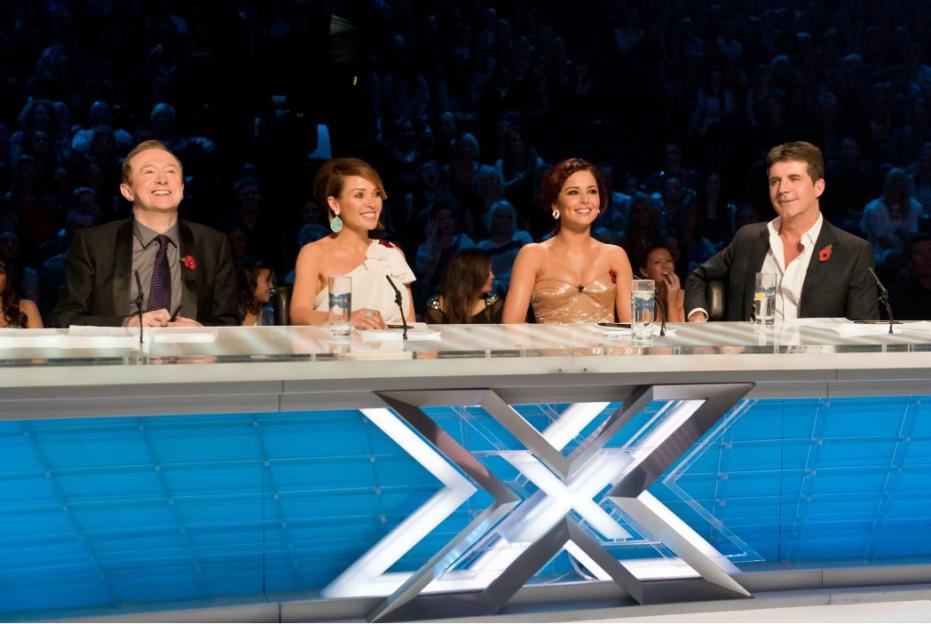 Judges Louis Walsh, Dannii Minogue, Cheryl Cole, and Simon Cowell at 'The X Factor' Live Show in London.