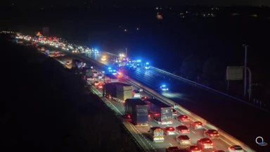 Woman, 30, and girl, 15, arrested after Kia driving wrong way down M1 smashes into car – as man rushed to hospital