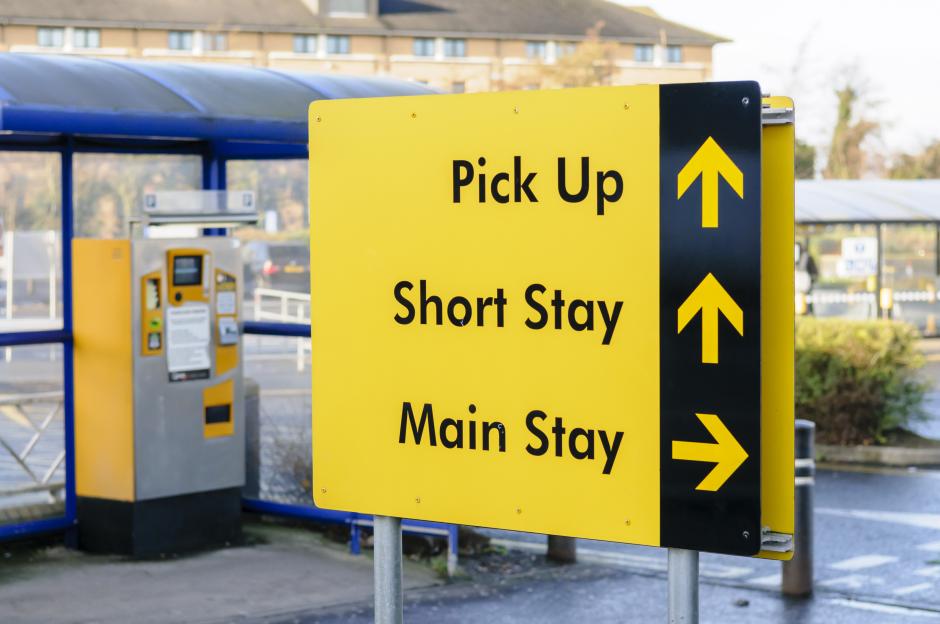 Sign to the Pickup spot, and short and main stay car parks.