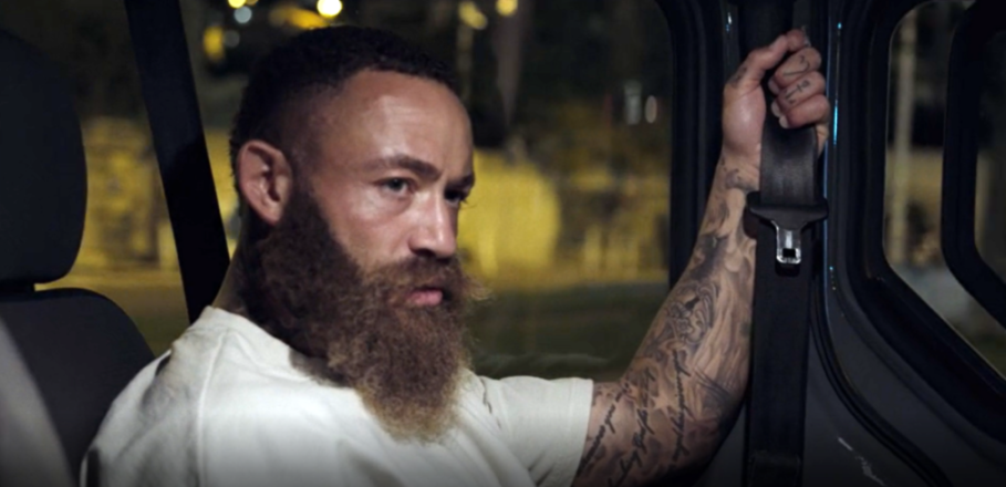 Ashley Cain looking out of a car window.