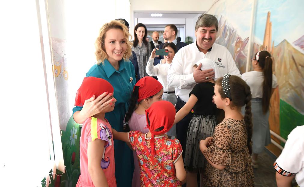 Maria Lvova-Belova interacting with children in Chechnya.