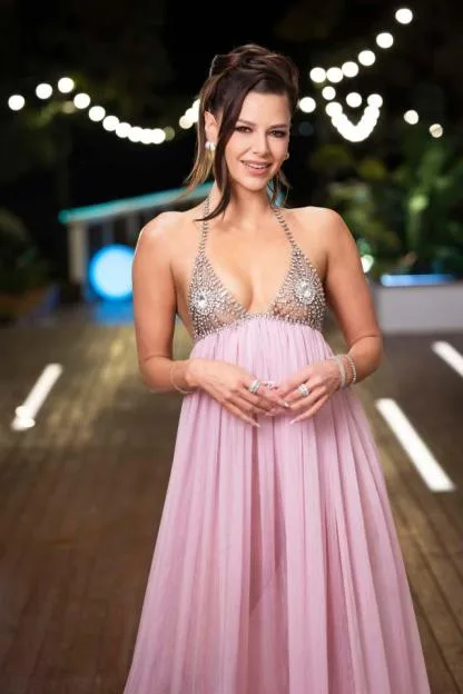 Ariana Madix wears a plunging pink gown with a crystal halter top on Love Island USA.