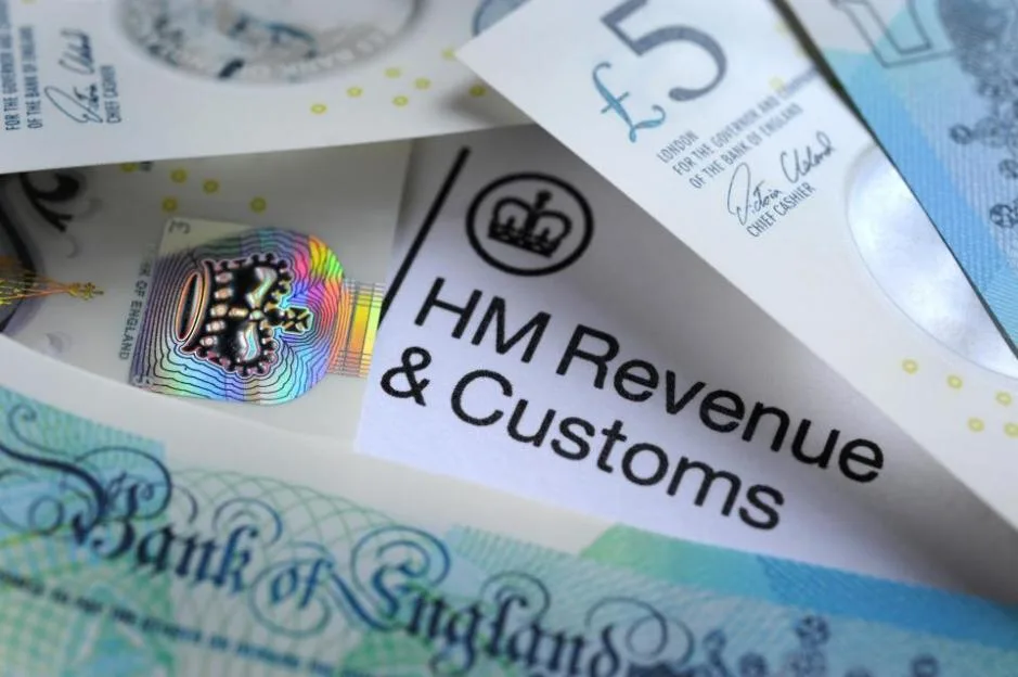 A letterhead for "HM Revenue & Customs" laid over British pound sterling banknotes.