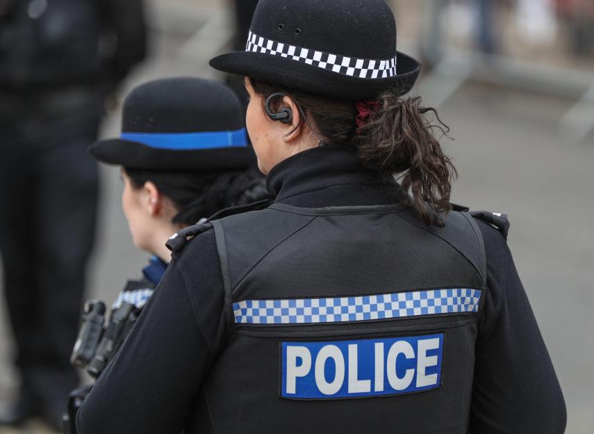 Female PCSO and Police officer on duty in Winchester, Hampshire, UK