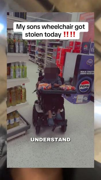 A young boy in a wheelchair at a grocery store, with text overlay: "My sons wheelchair got stolen today !!!!" and "UNDERSTAND".