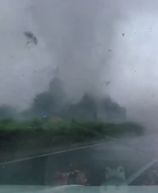 A van tossed by a weak tornado in Haining, Zhejiang Province.
