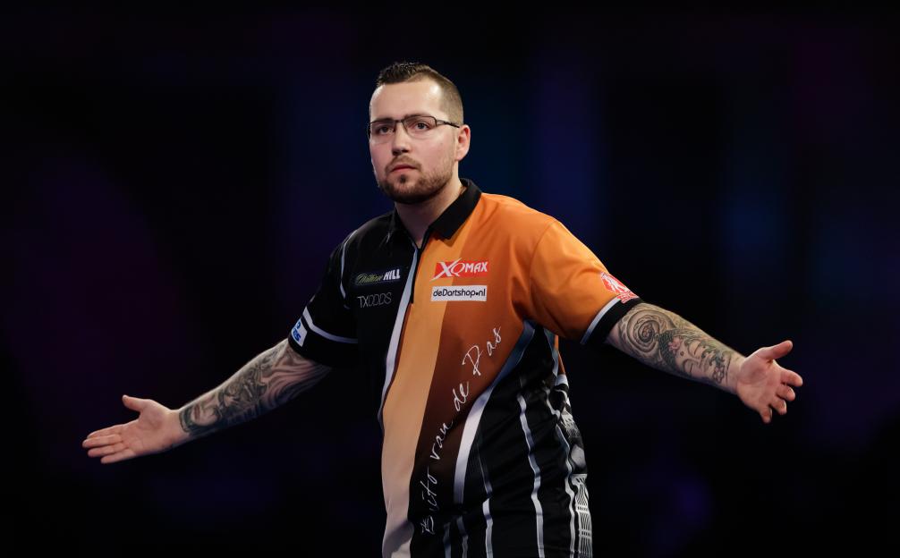 Benito van de Pas celebrating during a darts match.