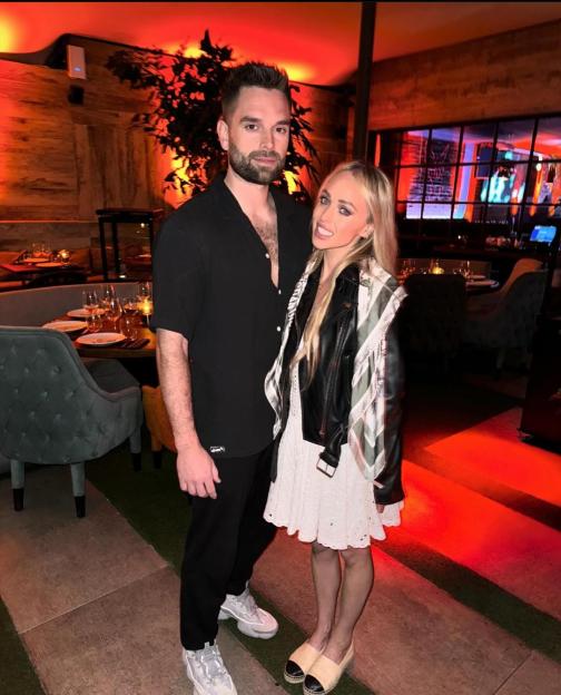 Ollie Piotrowski with his fiancée, Hollyoaks actress Jorgie Porter, in a restaurant.