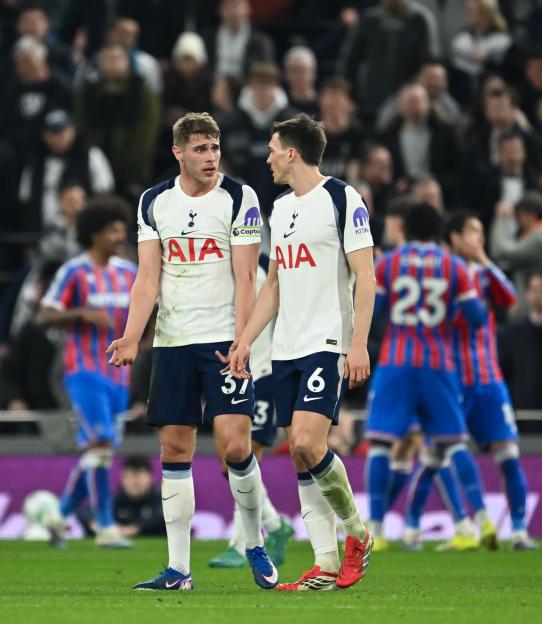 Tottenham Hotspur players Micky van de Ven and Joao Palhinha on the field.