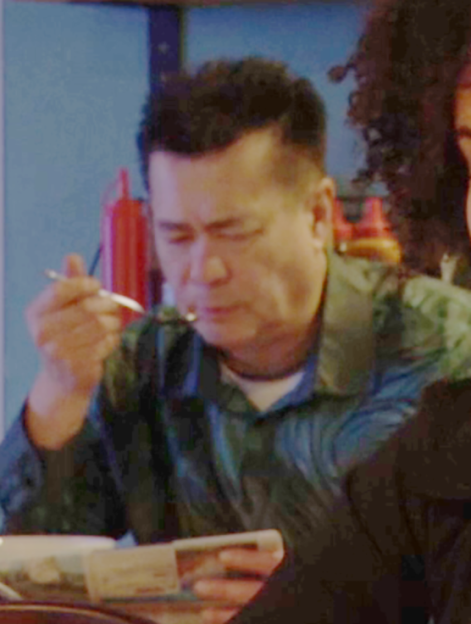 Man eating nothing in a cafe.
