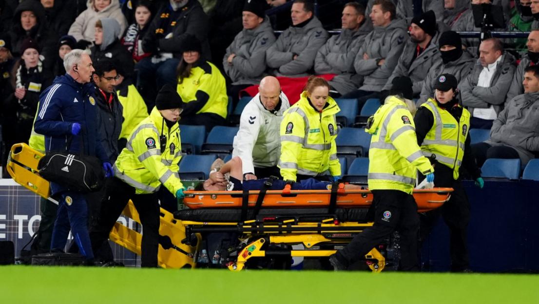 Medical staff carrying an injured player on a stretcher during the Scotland v Denmark World Cup Qualifiers.