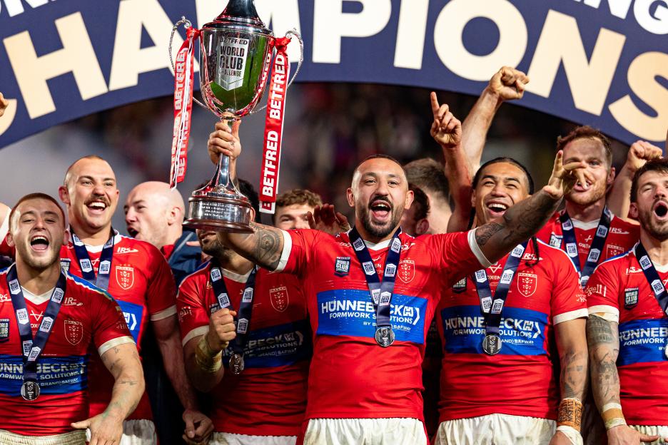 Hull KR rugby league players celebrating with the World Club Challenge trophy.