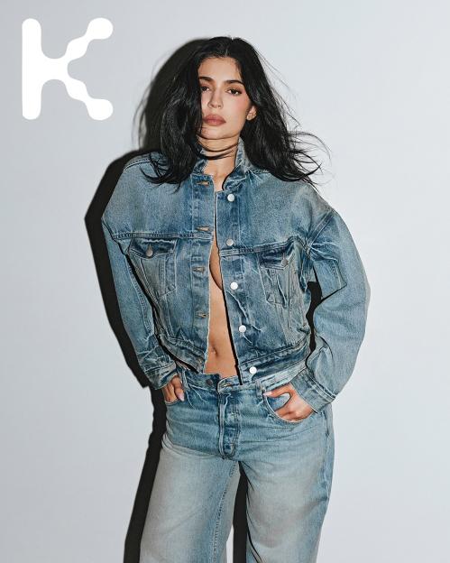 Kylie Jenner in an unbuttoned denim jacket and matching jeans for her new Khy clothing collection.