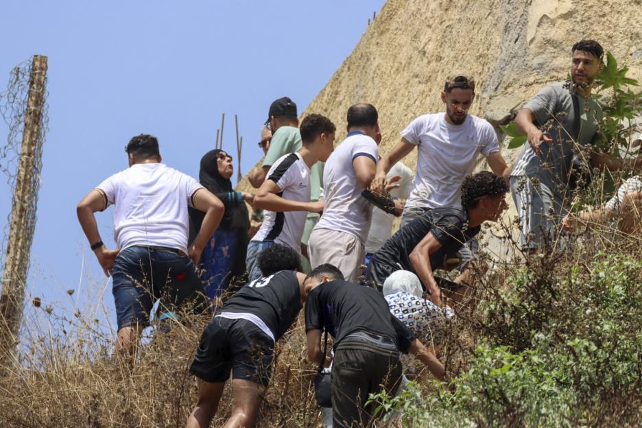 Hundreds of migrants swim across to Ceuta from Morocco