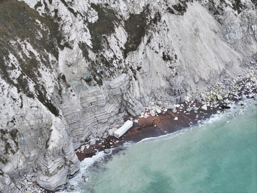 Shipping container washed ashore at Cows Gap, Beachy Head, East Sussex.