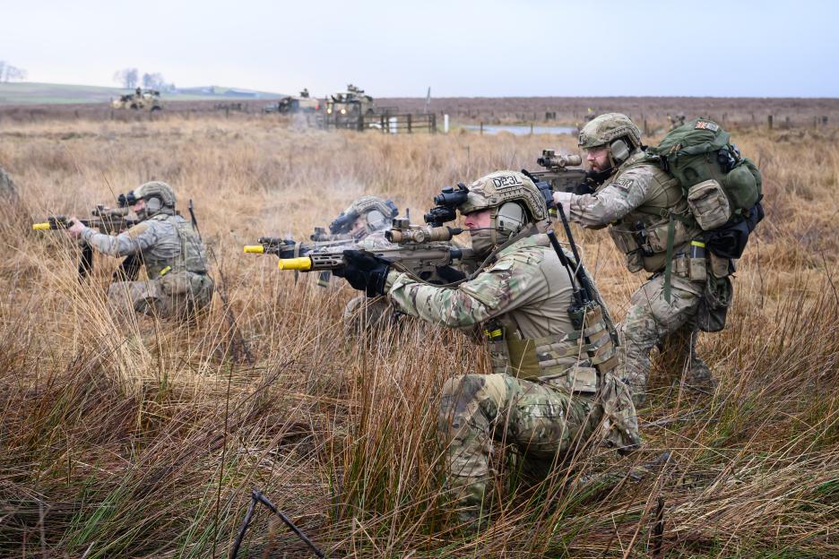 Special Operations Forces members engage an enemy location during a validation exercise.