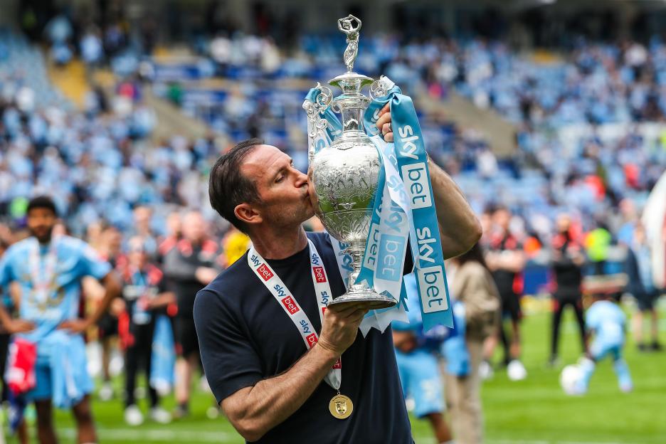 Coventry City Manager Frank Lampard kisses the Sky Bet Championship trophy.