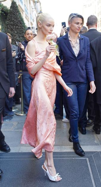 Anya Taylor-Joy Stuns in Dusky Pink Dress, Arriving at Dior's PFW Show with a Rose in Hand