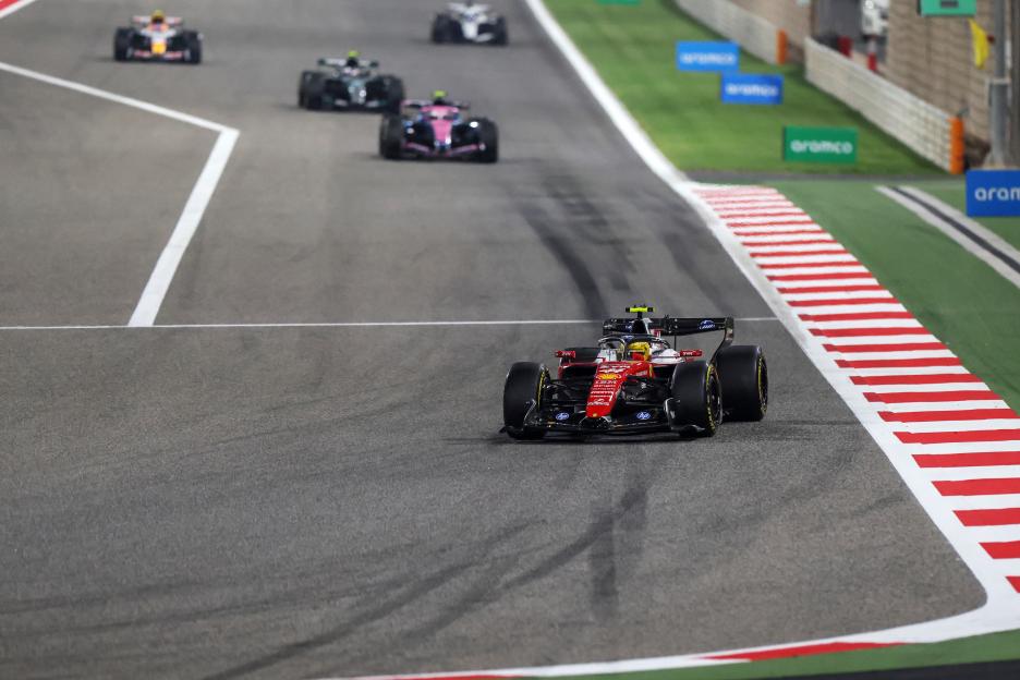Lewis Hamilton driving a Scuderia Ferrari SF-26 on track with other Formula 1 cars during F1 Testing at Bahrain International Circuit.