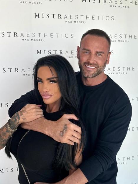 Katie Price and Lee Andrews pose in front of a wall with "Mistr Aesthetics" branding.