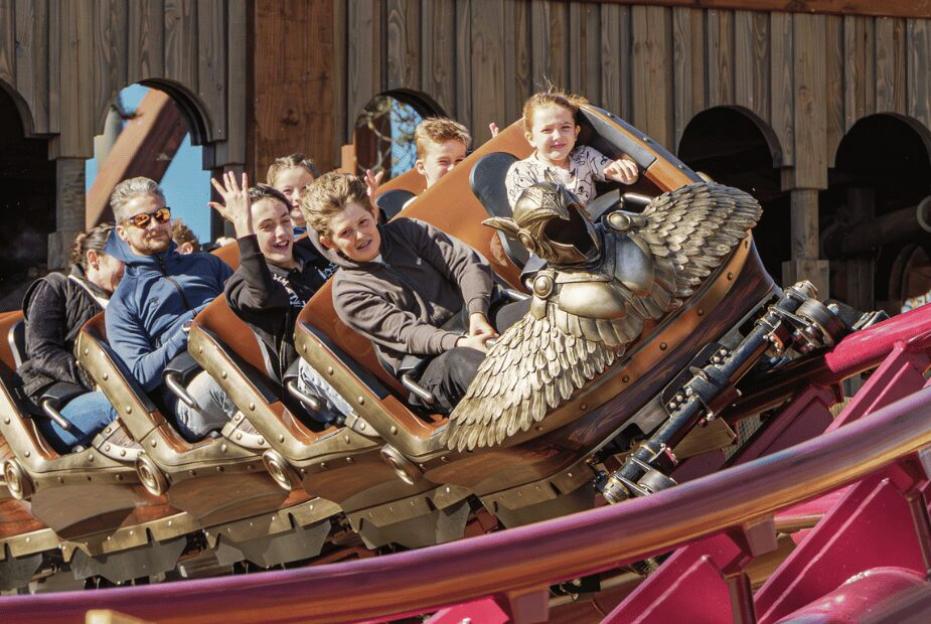 People enjoying a roller coaster ride.