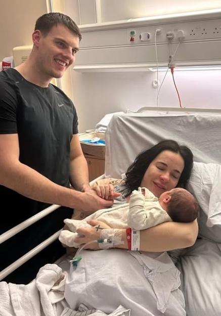 Stephanie Davies, Joseph, and their son Samuel in the hospital.