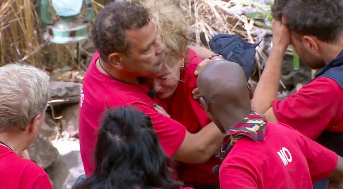 Beverley Callard being comforted by other cast members after her departure from the camp.