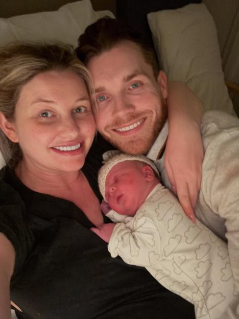 Amy Hart and partner with their newborn baby boy.