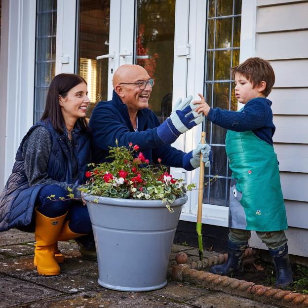 Gregg Wallace, his wife Anna, and son Sid gardening together.