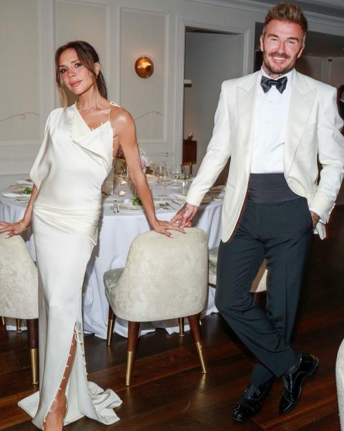 Victoria and David Beckham posing together at David's 50th birthday celebration.