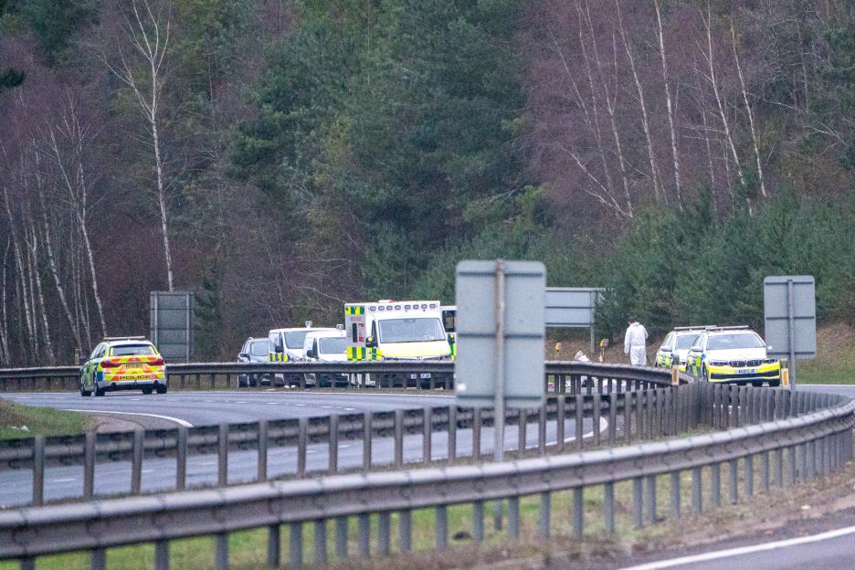 Police and ambulance vehicles at a scene on the A11 road near Thetford, Norfolk.