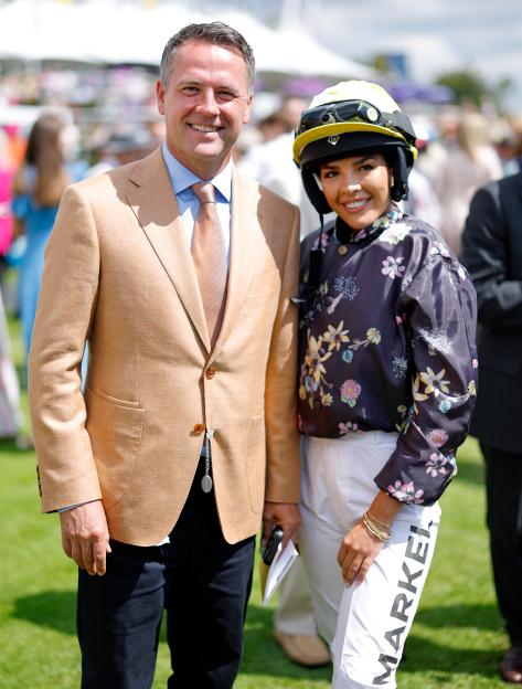 Michael Owen and daughter Gemma Owen smiling on the racetrack.