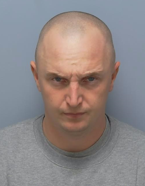 Mugshot of Adam David Wright.