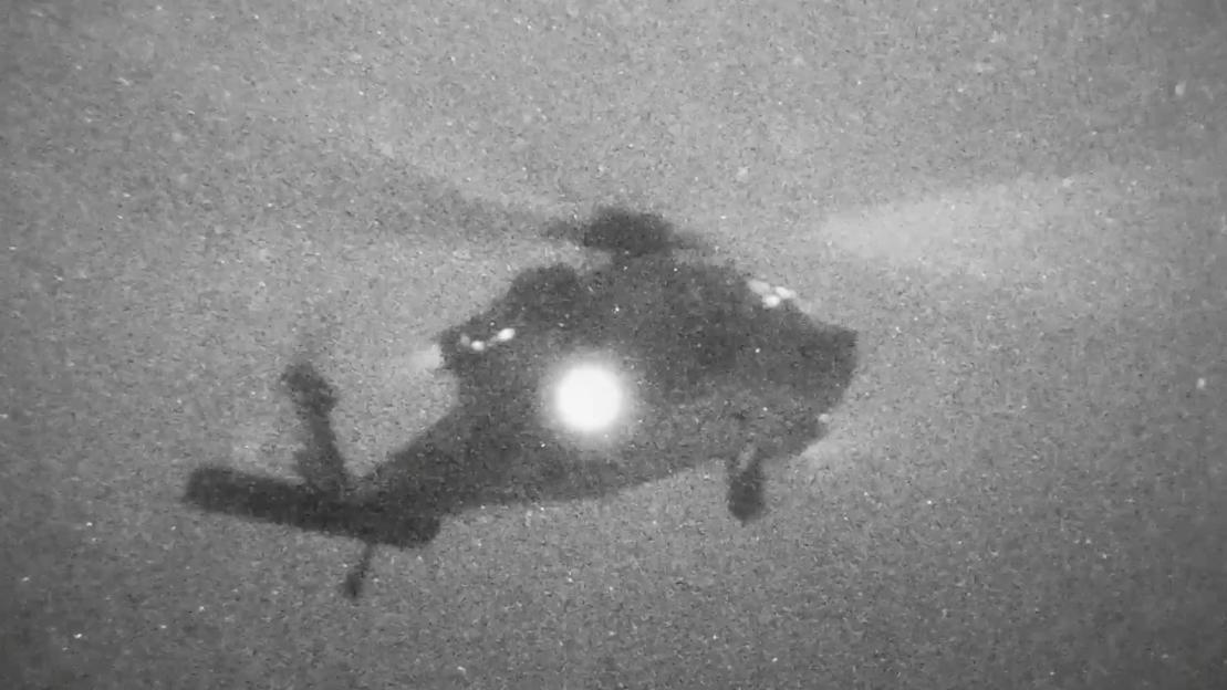 A helicopter carries U.S. Marines from the amphibious assault ship USS Tripoli at an unknown location