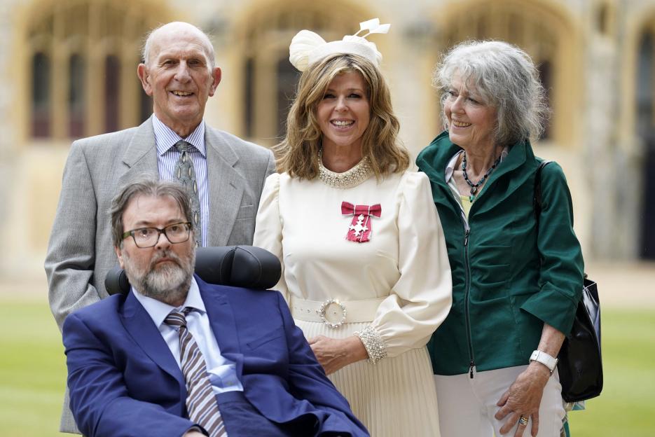 Kate Garraway poses with her Member of the Order of the British Empire medal, alongside her husband Derek Draper and parents Gordon and Marilyn Garraway.