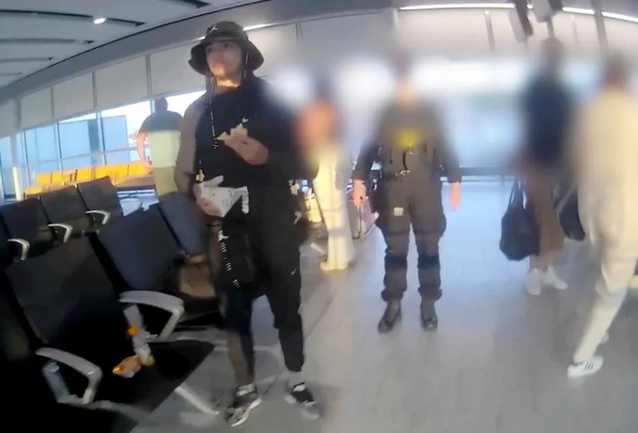 Ki Grant-Finlayson is arrested by police at London Gatwick airport.
