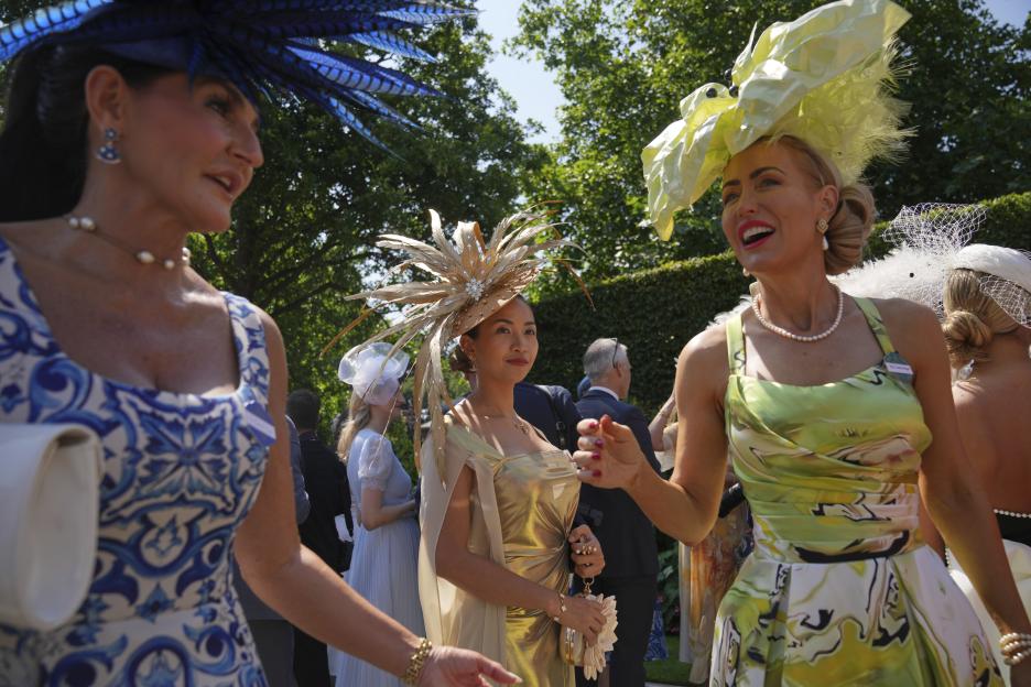 Women in elaborate hats at the Royal Ascot.