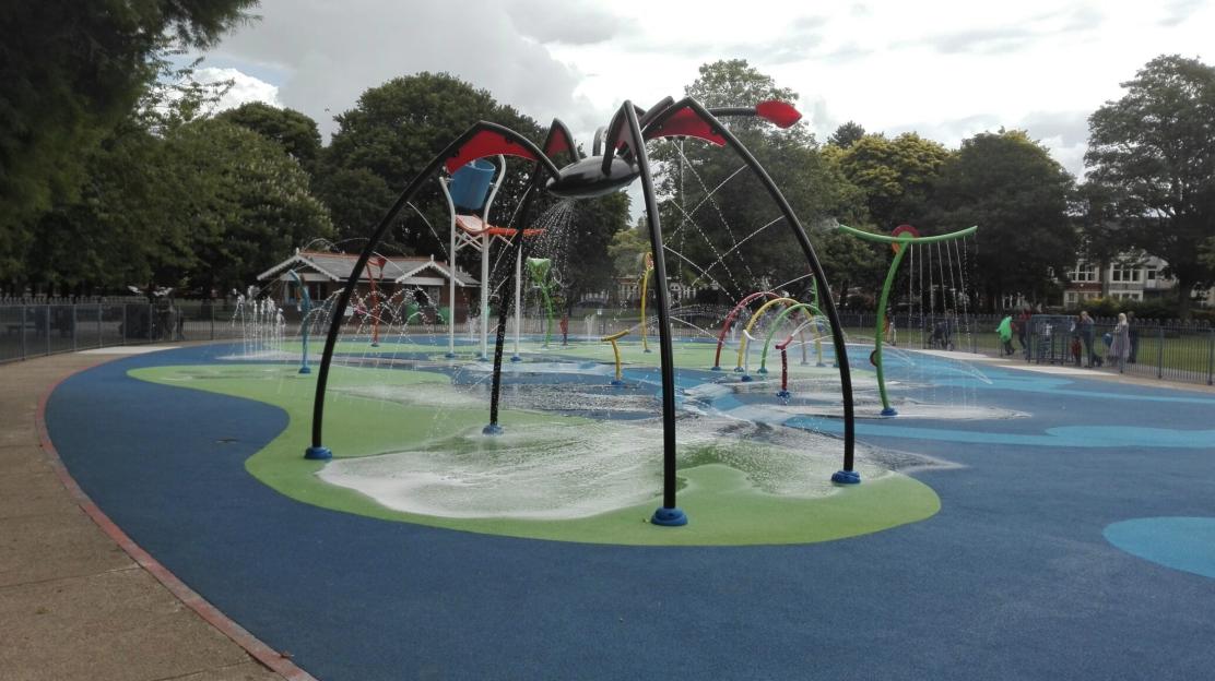 Victoria Park splashpad with multiple water features, including a large spider-shaped one.
