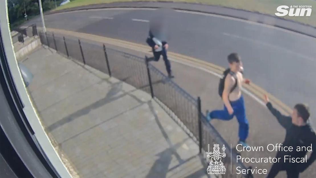 Three thugs running on a street with a car and a fence.