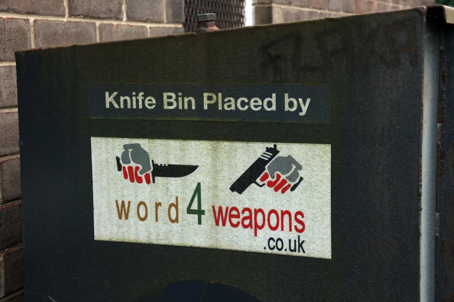 A "Welcome to Sheffield" sign on a dilapidated building.