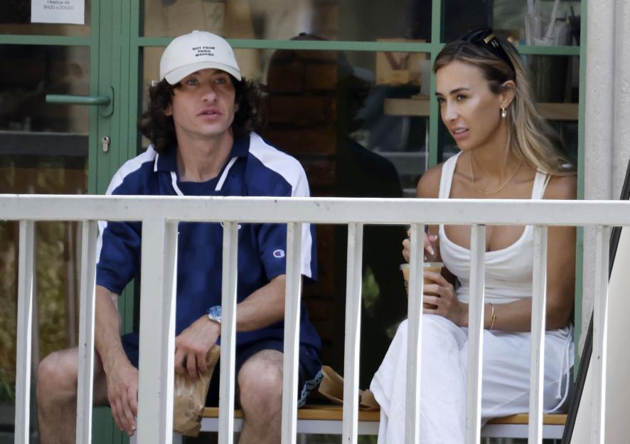 Barry Keoghan and his new girlfriend sitting at an outdoor coffee shop in Barcelona.