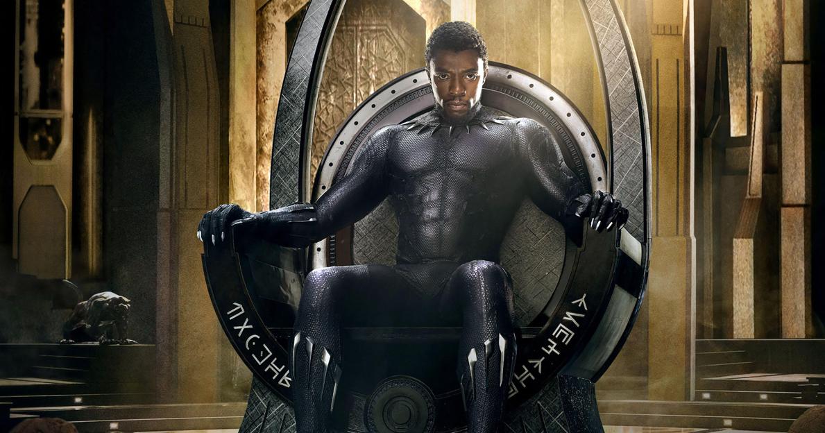 Chadwick Boseman as Black Panther seated on a throne.