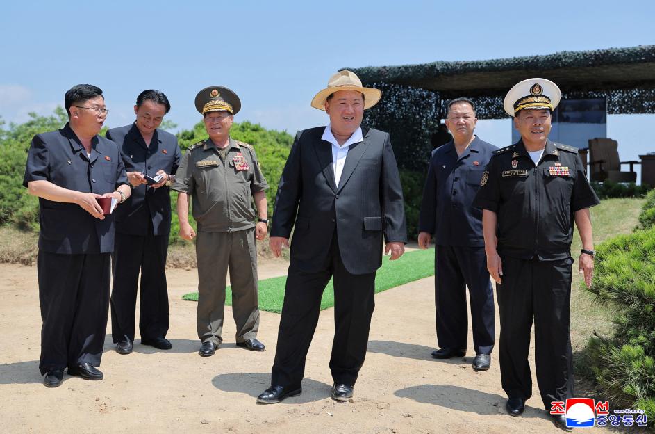 North Korean leader Kim Jong Un observes a cruise missile launch