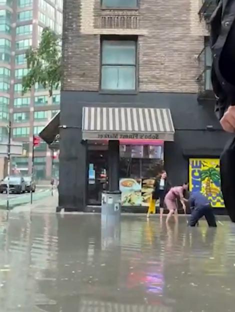 Severe flash flooding on a city street in New York City or New Jersey.