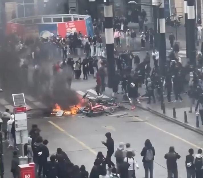 Brussels Erupts in Chaos: Rioters Smash Windows and Ignite Fires in Intense Street Battles with Police