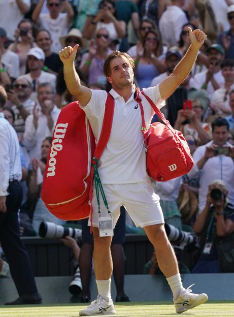 Arthur Fery saluting the crowd at Wimbledon with thumbs up.