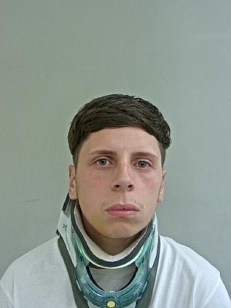 Cameron Hughes in a neck brace.